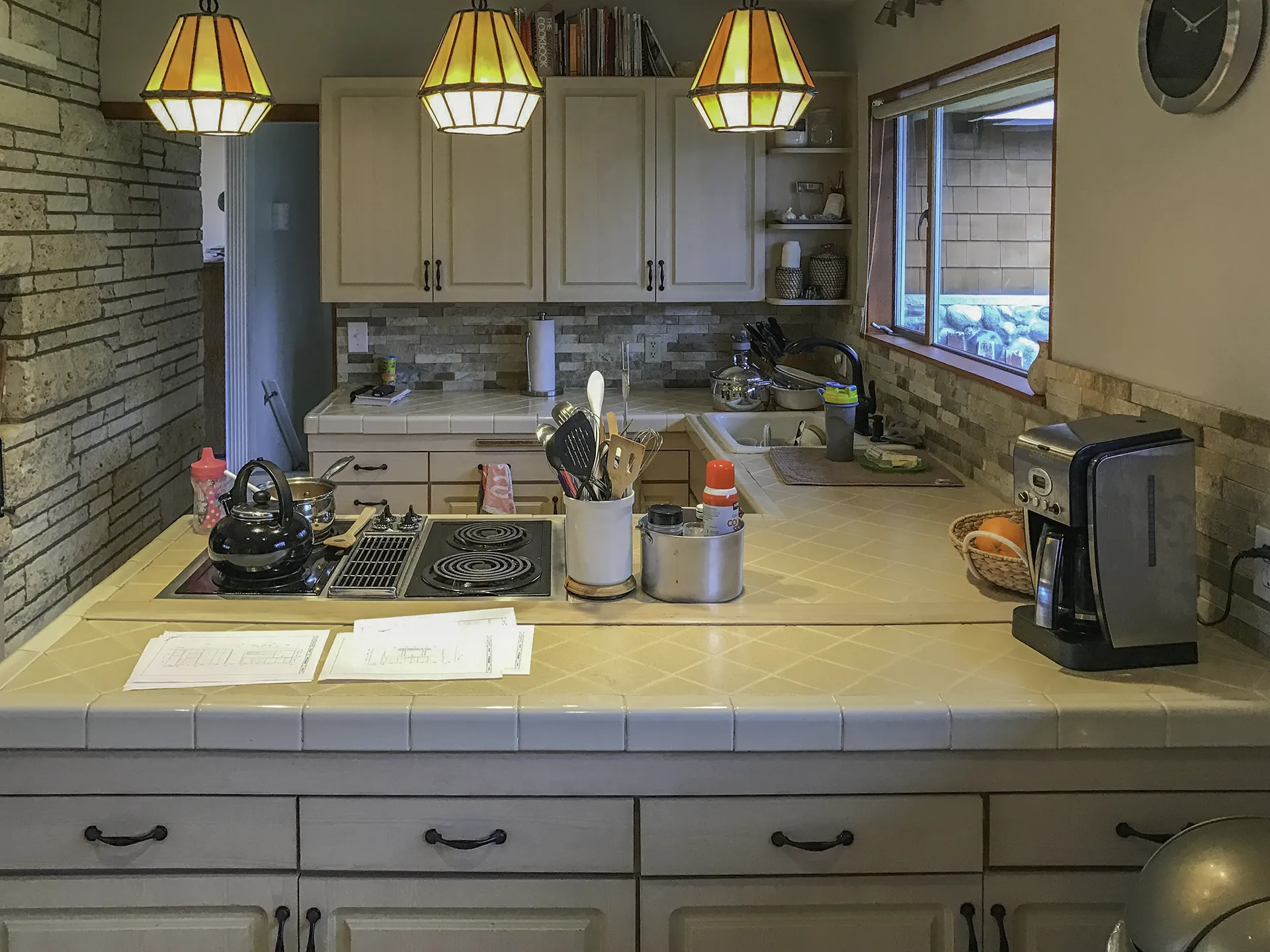 Normandy Park kitchen before remodel — original tile counters and dated cabinetry