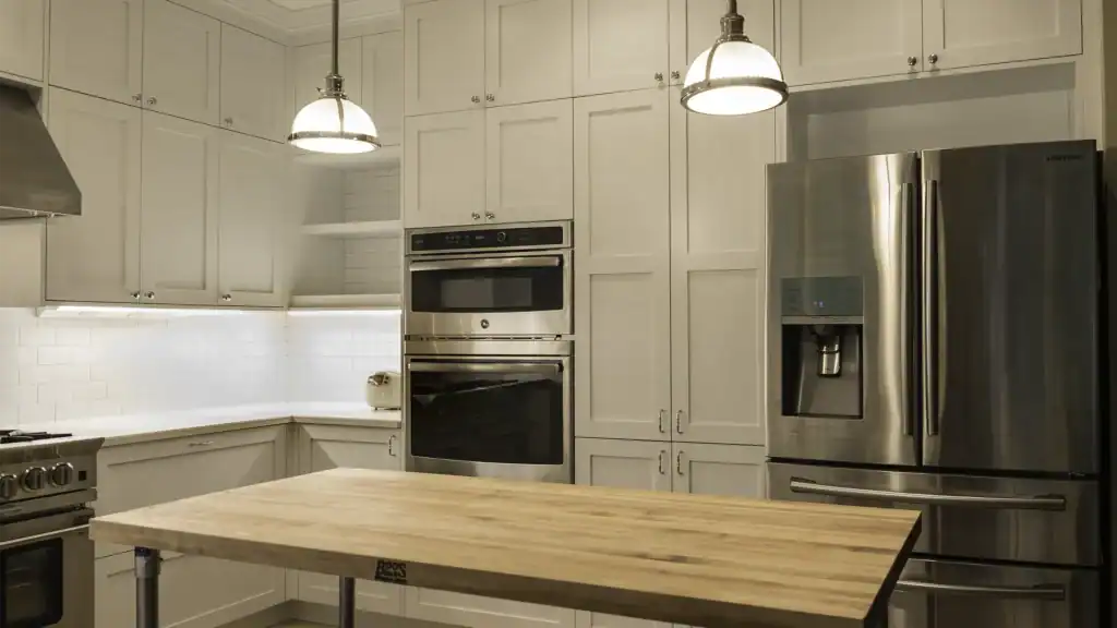Wall-mounted double oven with craftsman style white cabinets