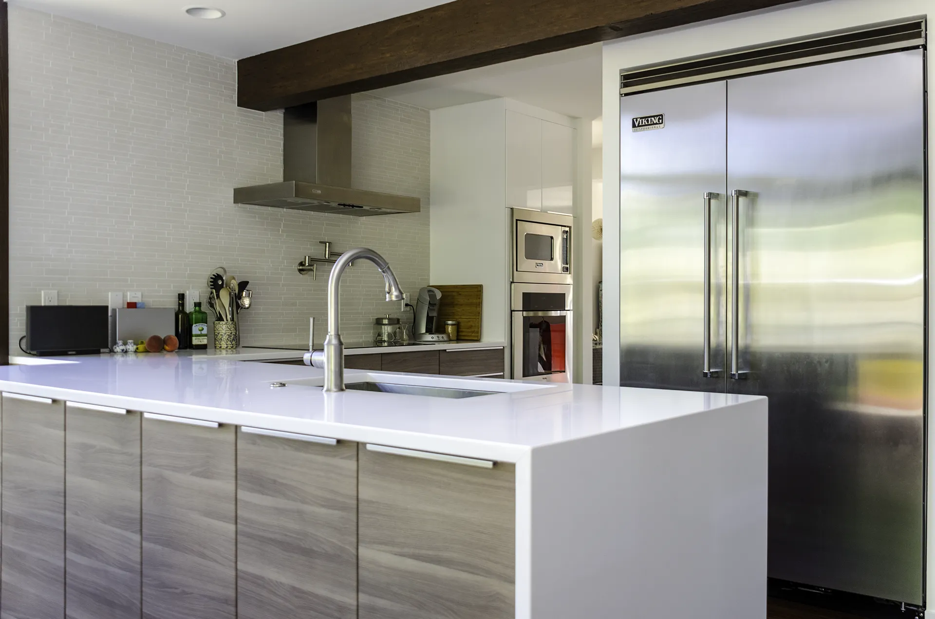 Kirkland IKEA kitchen remodel with SOFIELUND wood-grain cabinets, white quartz countertops, and Viking appliances