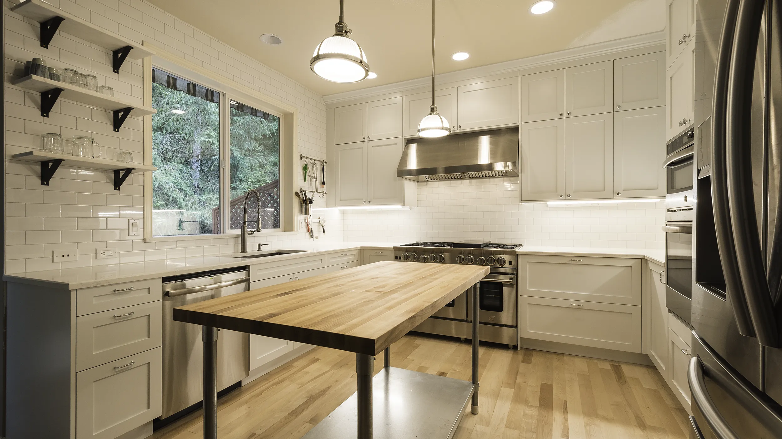 Redmond kitchen remodel with white shaker cabinets and Blue Star professional range