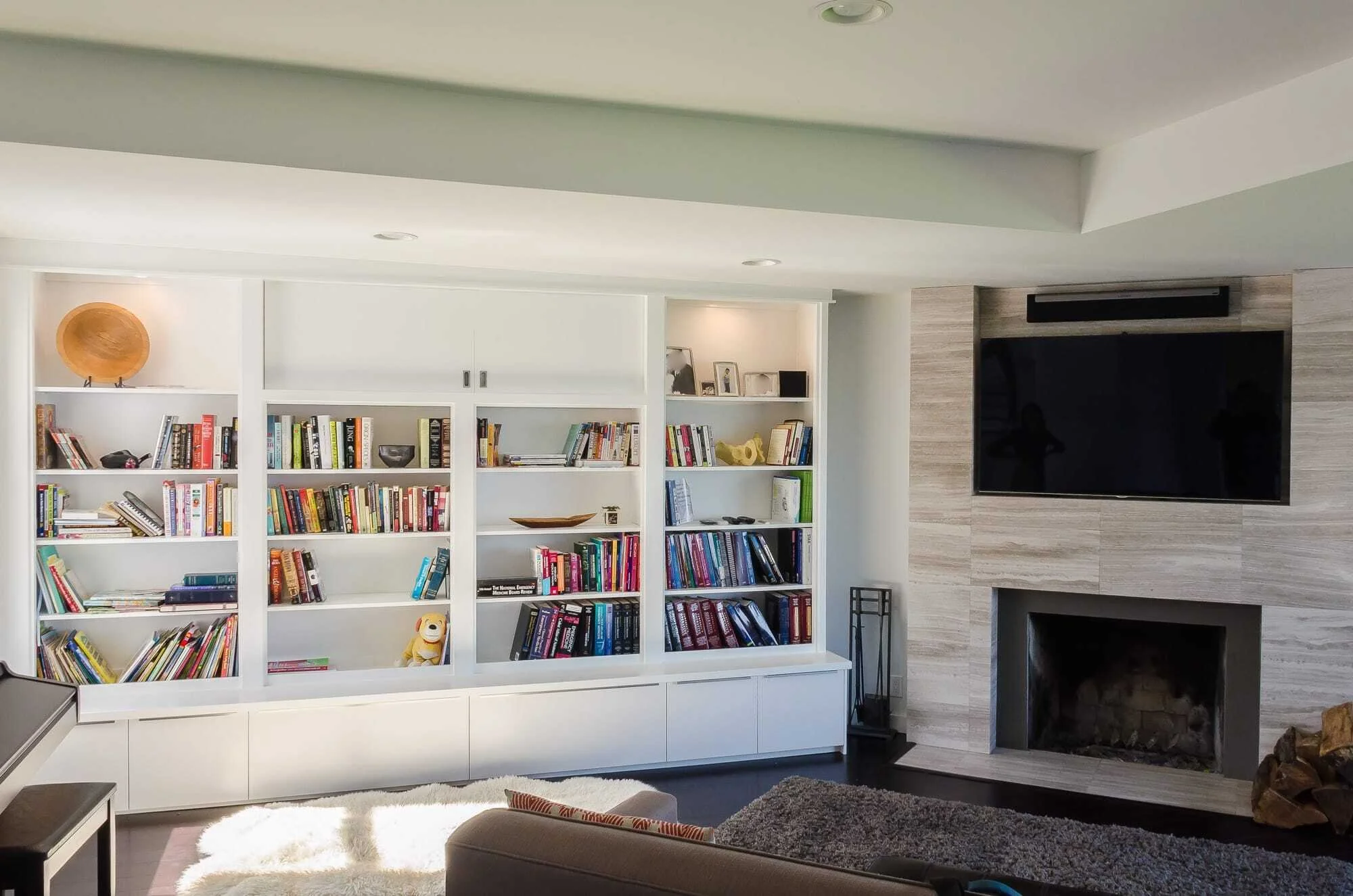 IKEA built-ins around fireplace using kitchen cabinets and Hemnes bookcases