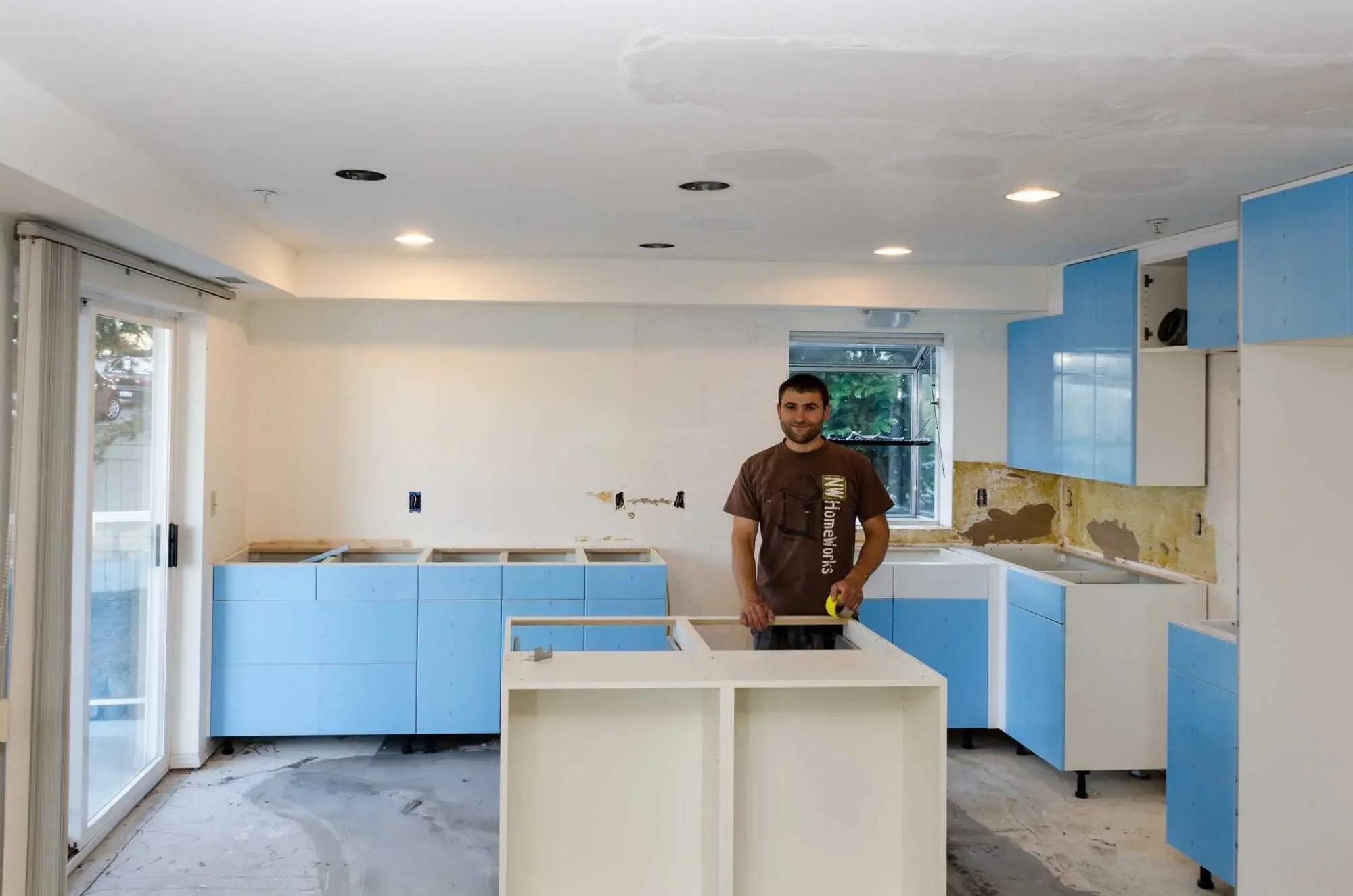 IKEA kitchen installation in progress, after the removal of the dining room wall