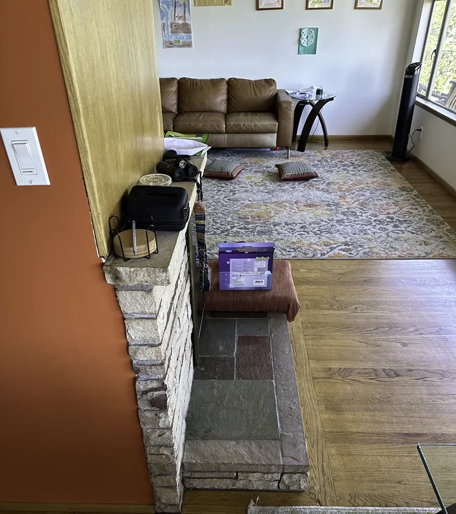 Raised hearth and wraparound fireplace before remodel