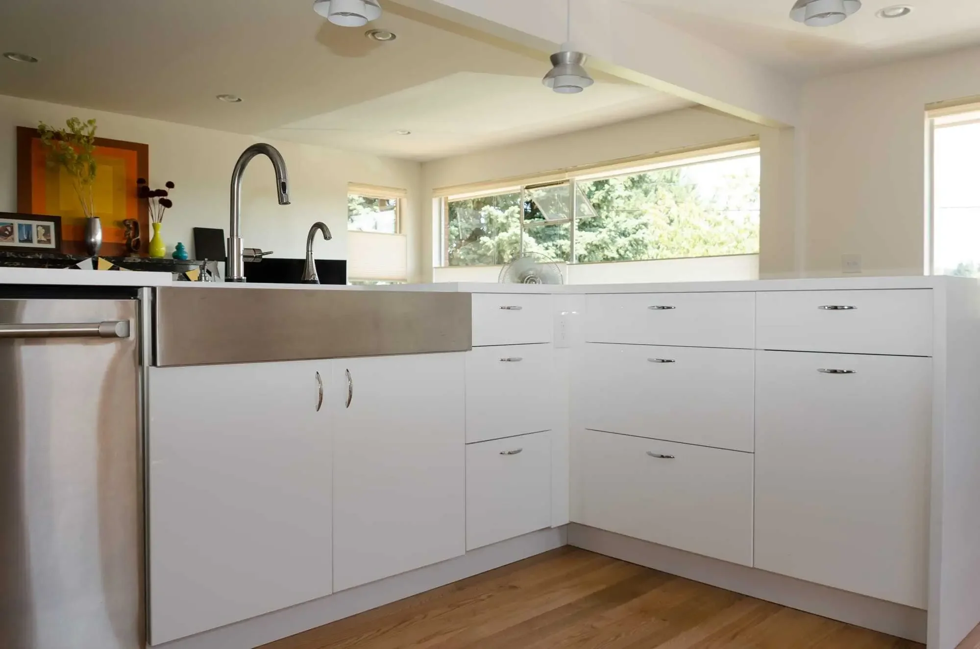 Stainless steel undermount sink with IKEA high-gloss white cabinets