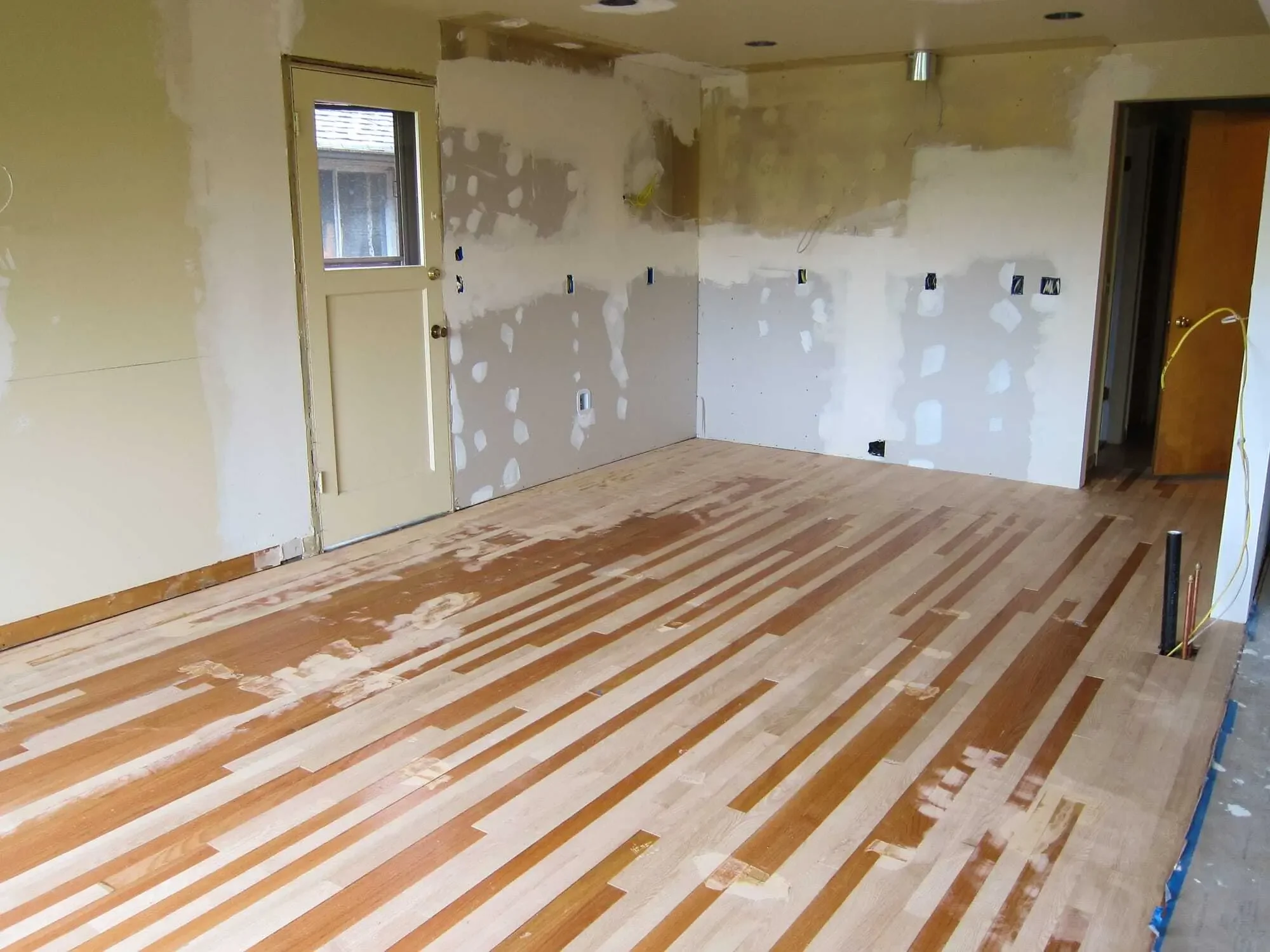 Interlacing new, matching hardwood flooring with the old to blend evenly