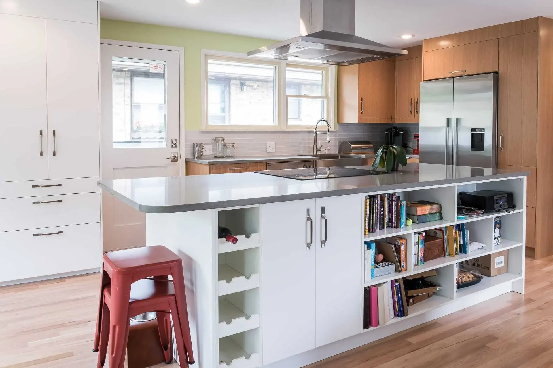 The island features site-built open shelving, made using IKEA's stock panels