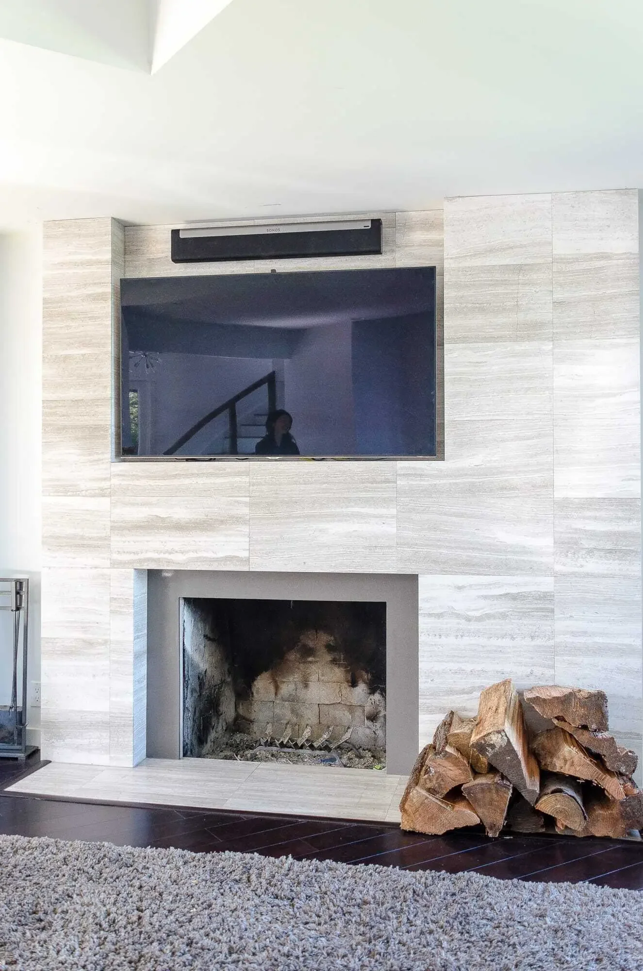 A cozy fireplace with custom tile surround