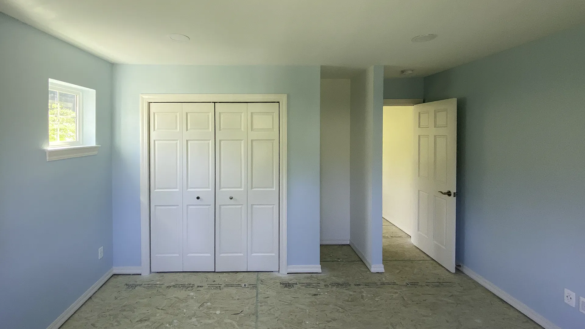 Finished bedroom with closet, painted walls, and new carpet