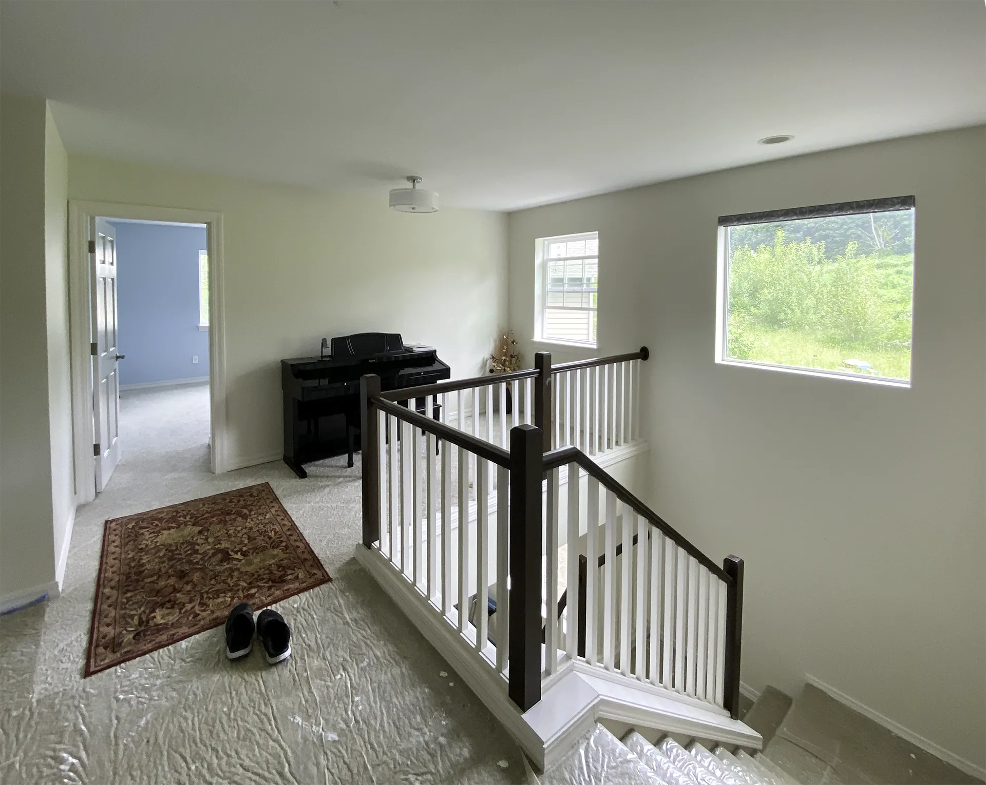 Completed bedroom addition in Bothell — new second-floor bedroom and hallway built inside existing home