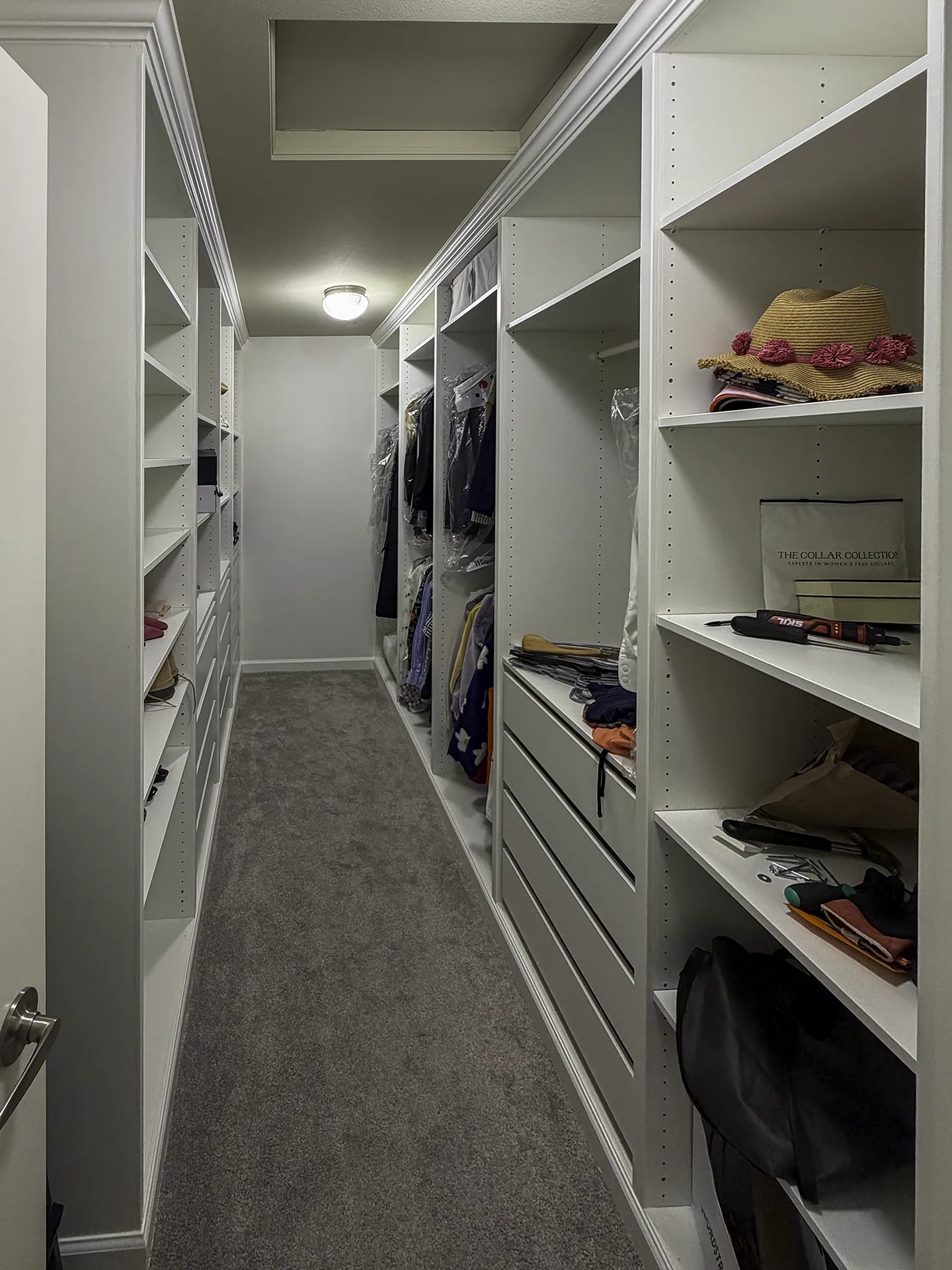 Finished IKEA PAX built-in walk-in closet in Newcastle, WA with crown molding and custom trim
