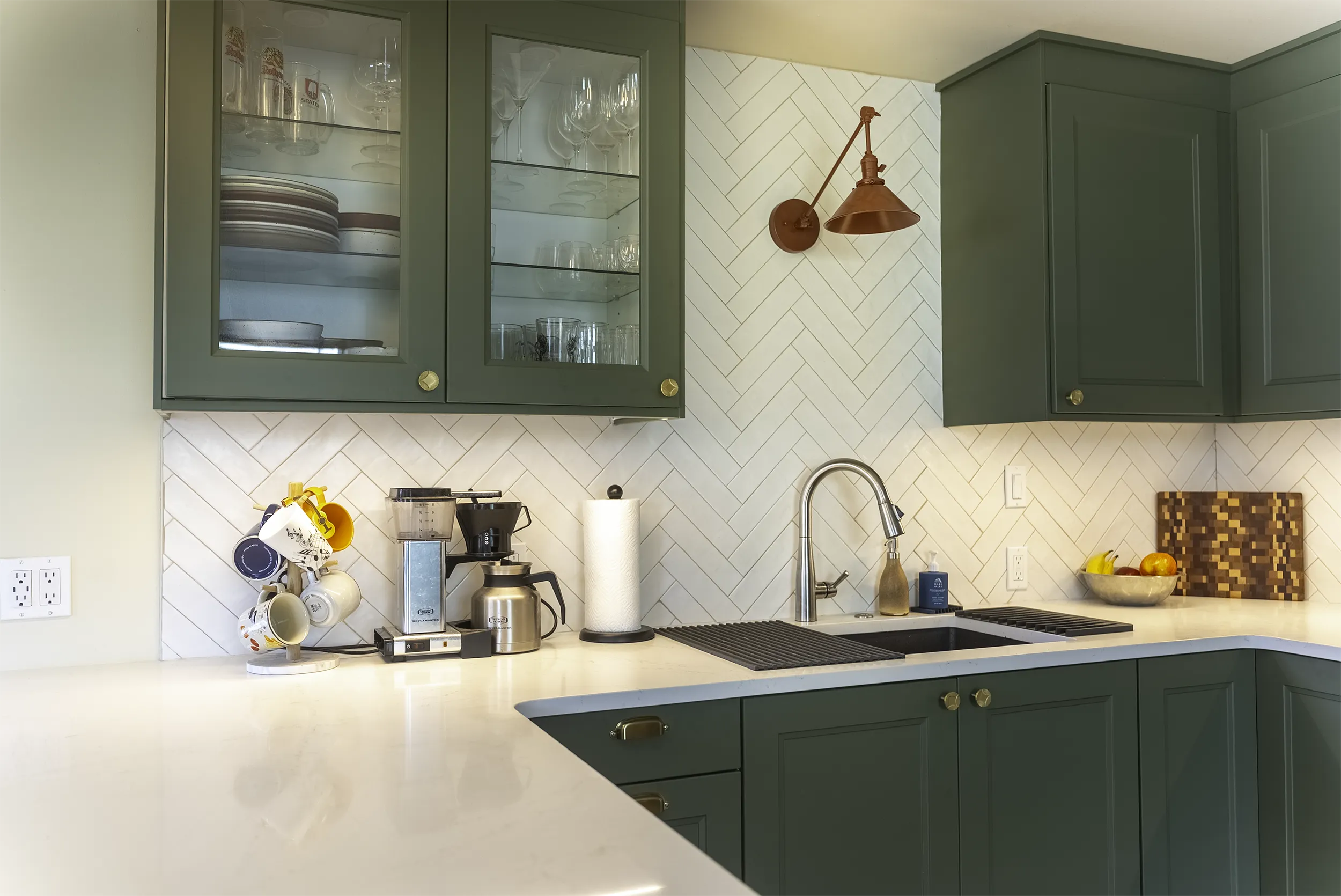 West Seattle kitchen remodel herringbone backsplash with a copper sconce and coffee station
