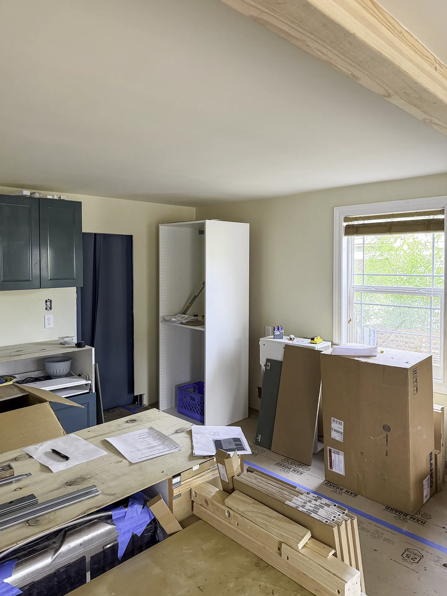 West Seattle IKEA kitchen remodel before photo with cabinet boxes and a new support beam